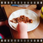 spreading bean mix on tortilla