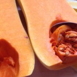 scrape out the squash seeds using a teaspoon